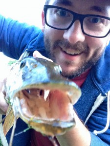 me holding a northern pike
