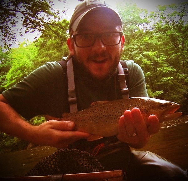 me holding a fairly big brown trout